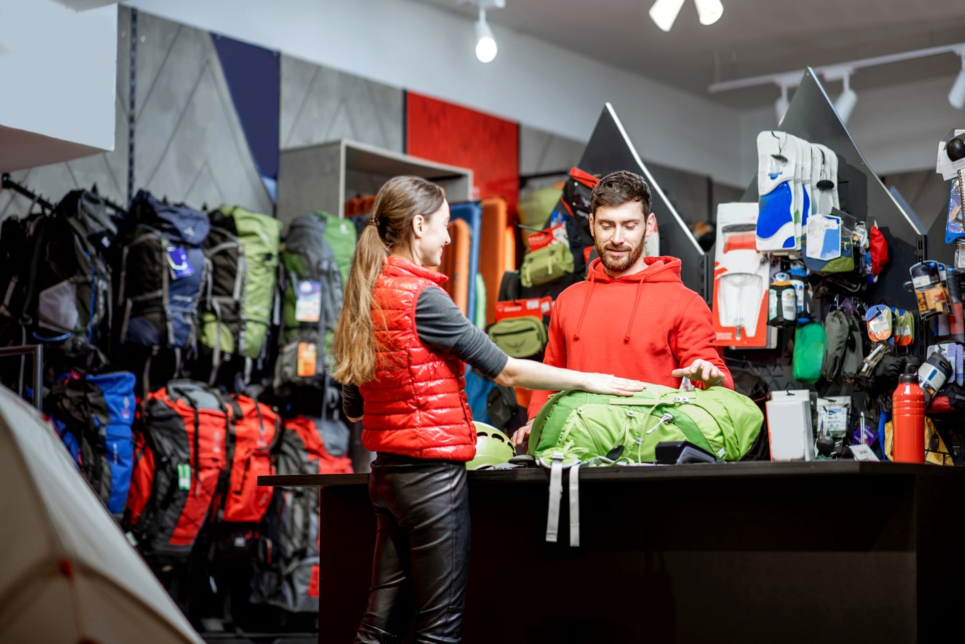 Customer choosing gear at an outdoor and sports store