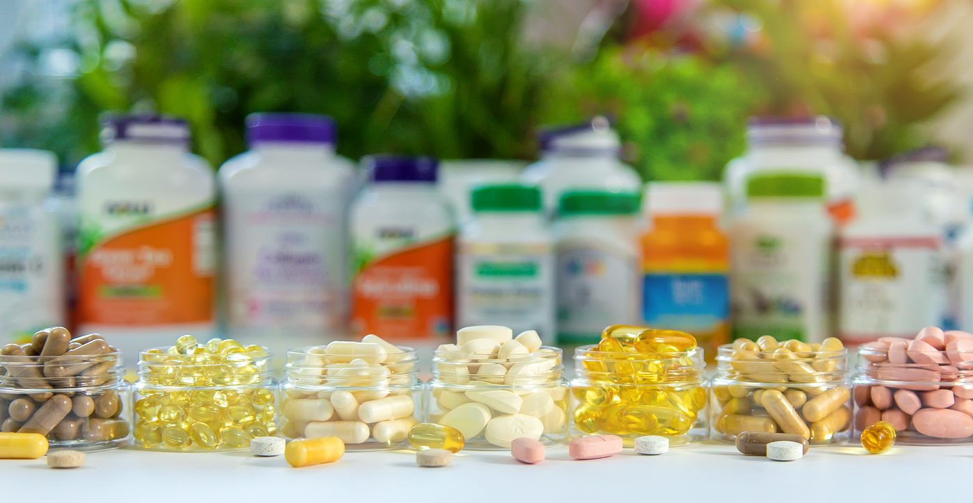 Jars of supplement capsules and nutraceutical bottles